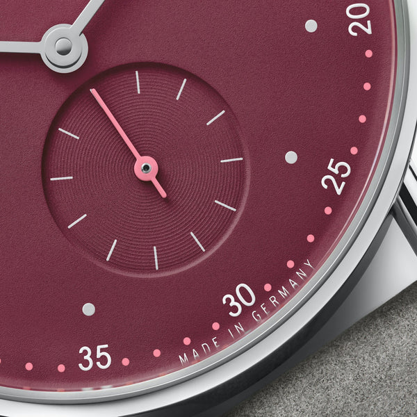 NOMOS Glashütte Metro 33 Muted Red Dial Hand Wound Watch | Exhibition Caseback