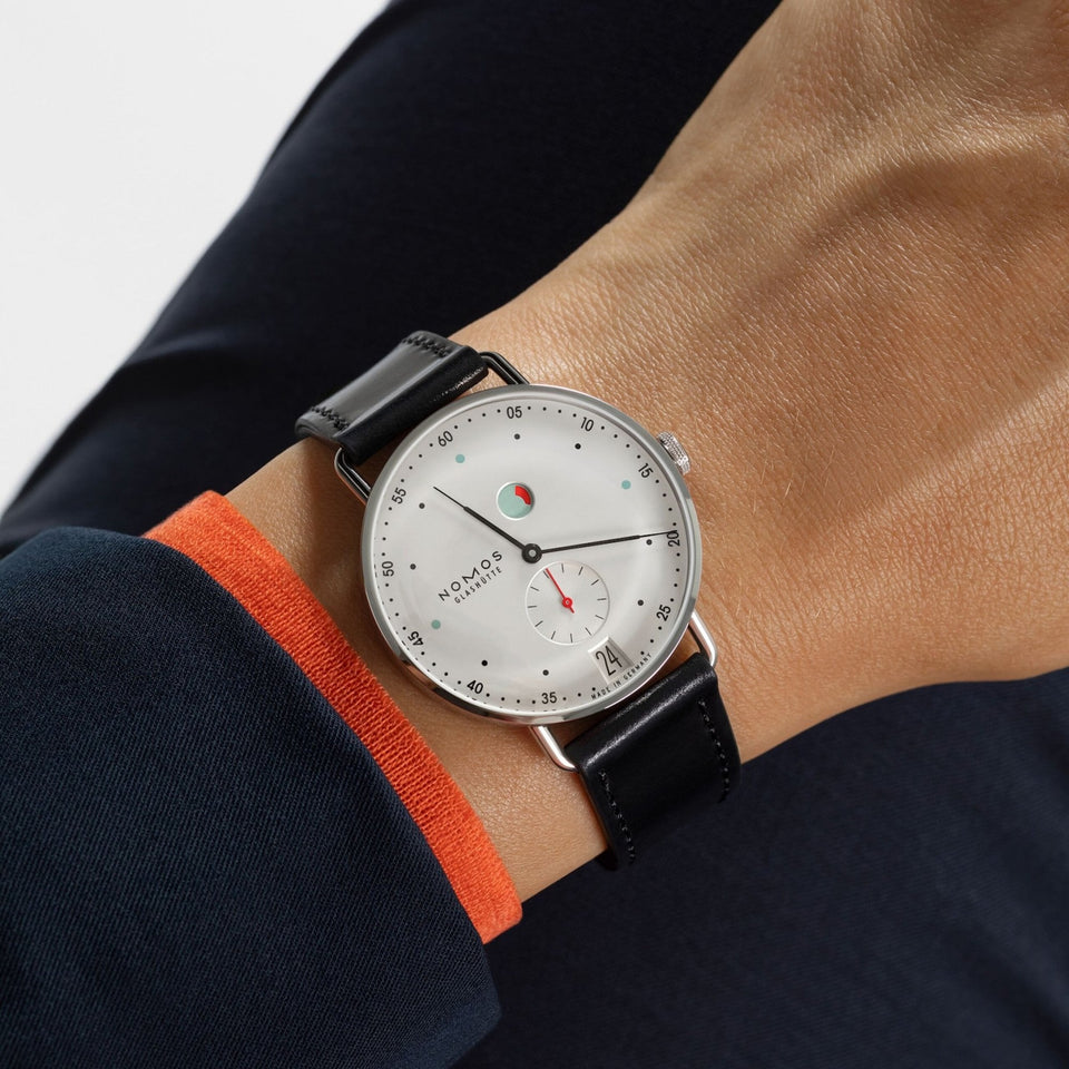 NOMOS Glashütte Metro Date Power Reserve White Dial 37mm Hand Wound Watch | Exhibition Caseback