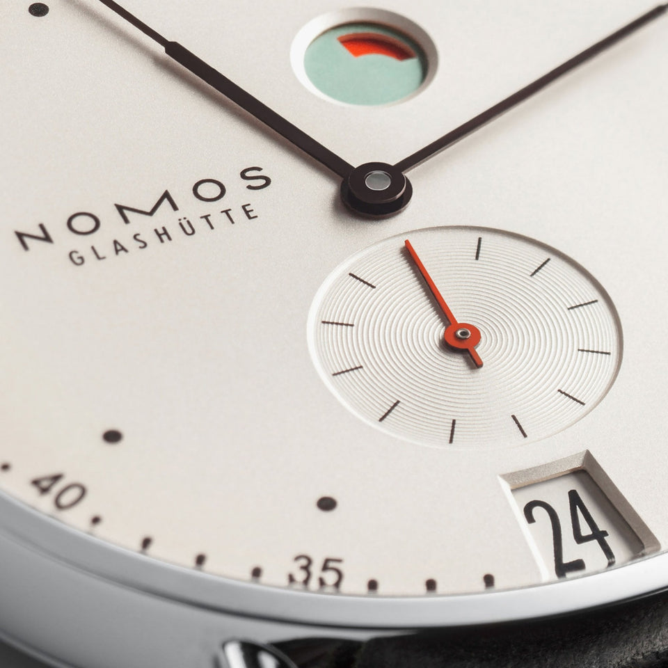 NOMOS Glashütte Metro Date Power Reserve White Dial 37mm Hand Wound Watch | Exhibition Caseback
